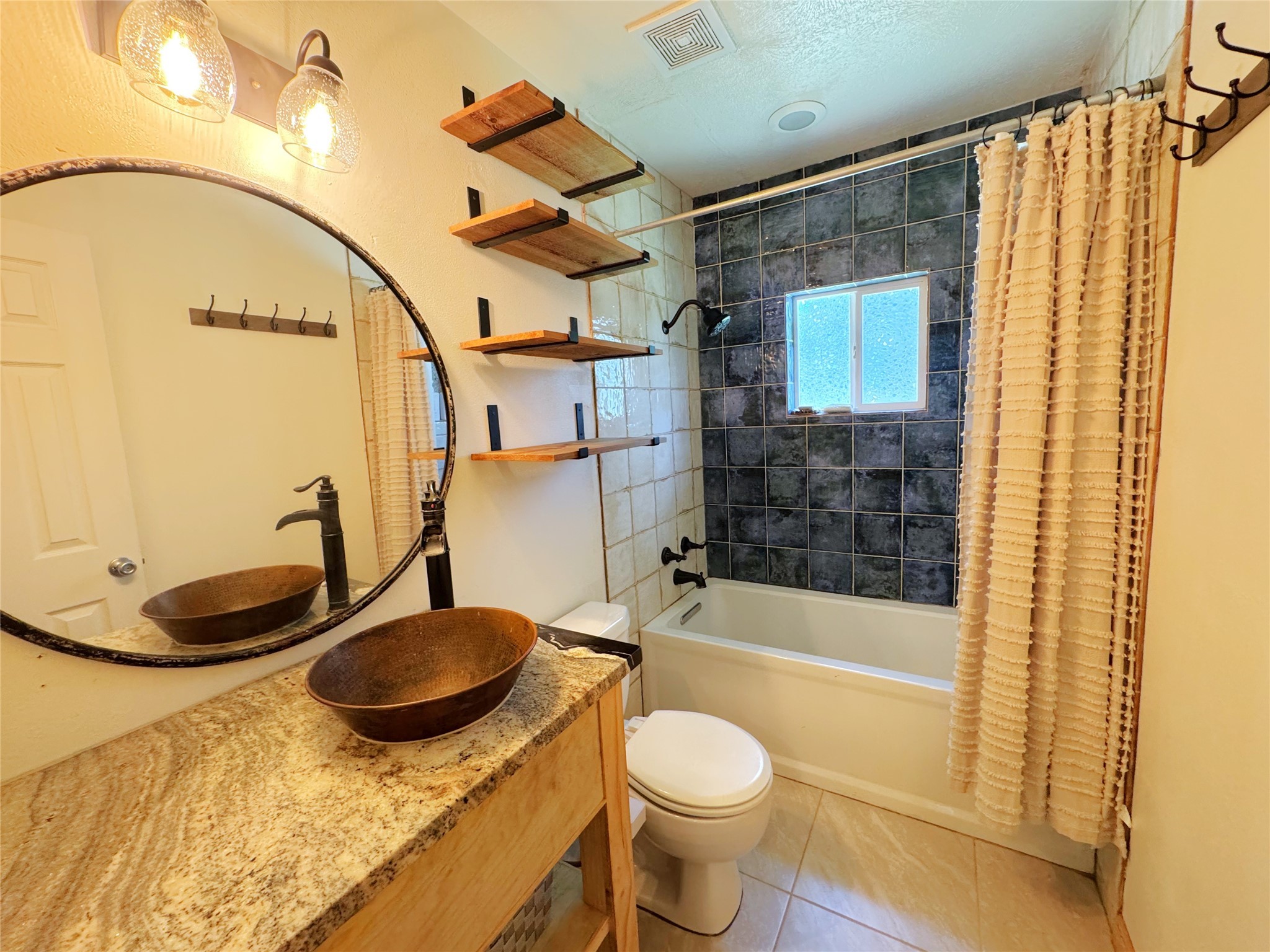 798 Port Boulevard Trinity, TX 75862 - Photo 16 of 31 a bathroom with a sink a toilet and shower