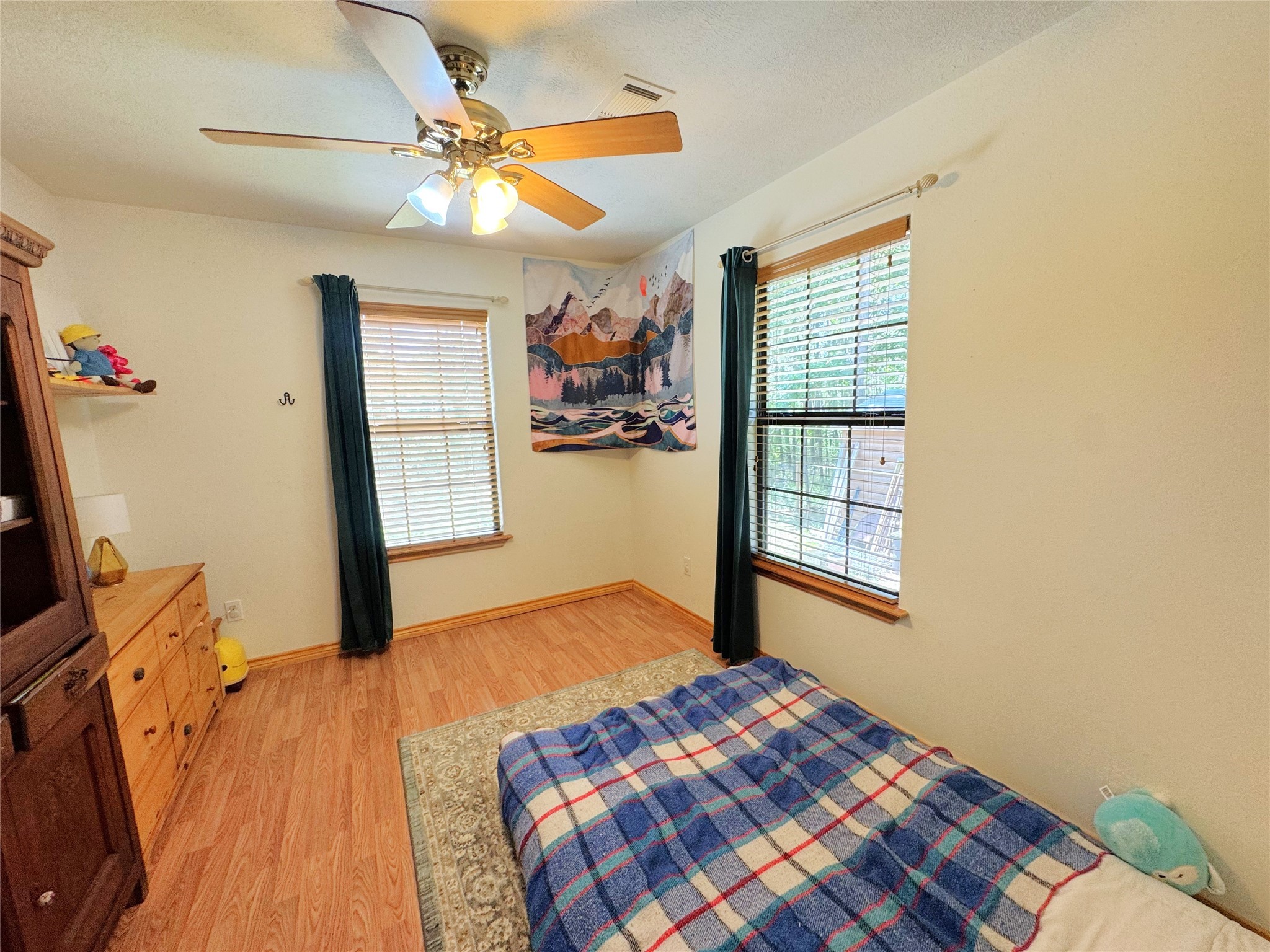 798 Port Boulevard Trinity, TX 75862 - Photo 18 of 31 a bedroom with a bed and a window