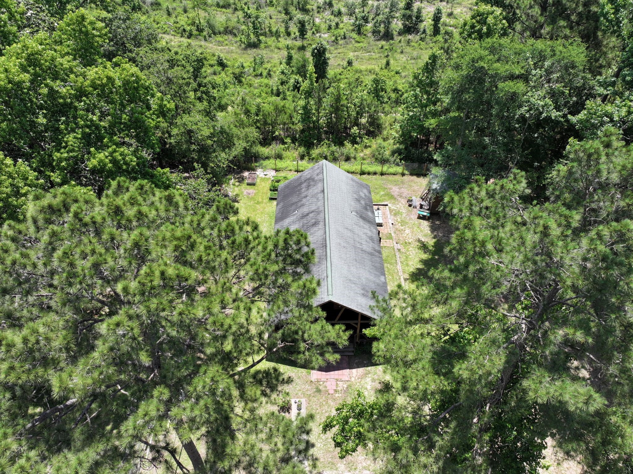 798 Port Boulevard Trinity, TX 75862 - Photo 2 of 31 an aerial view of a house with a yard and large trees