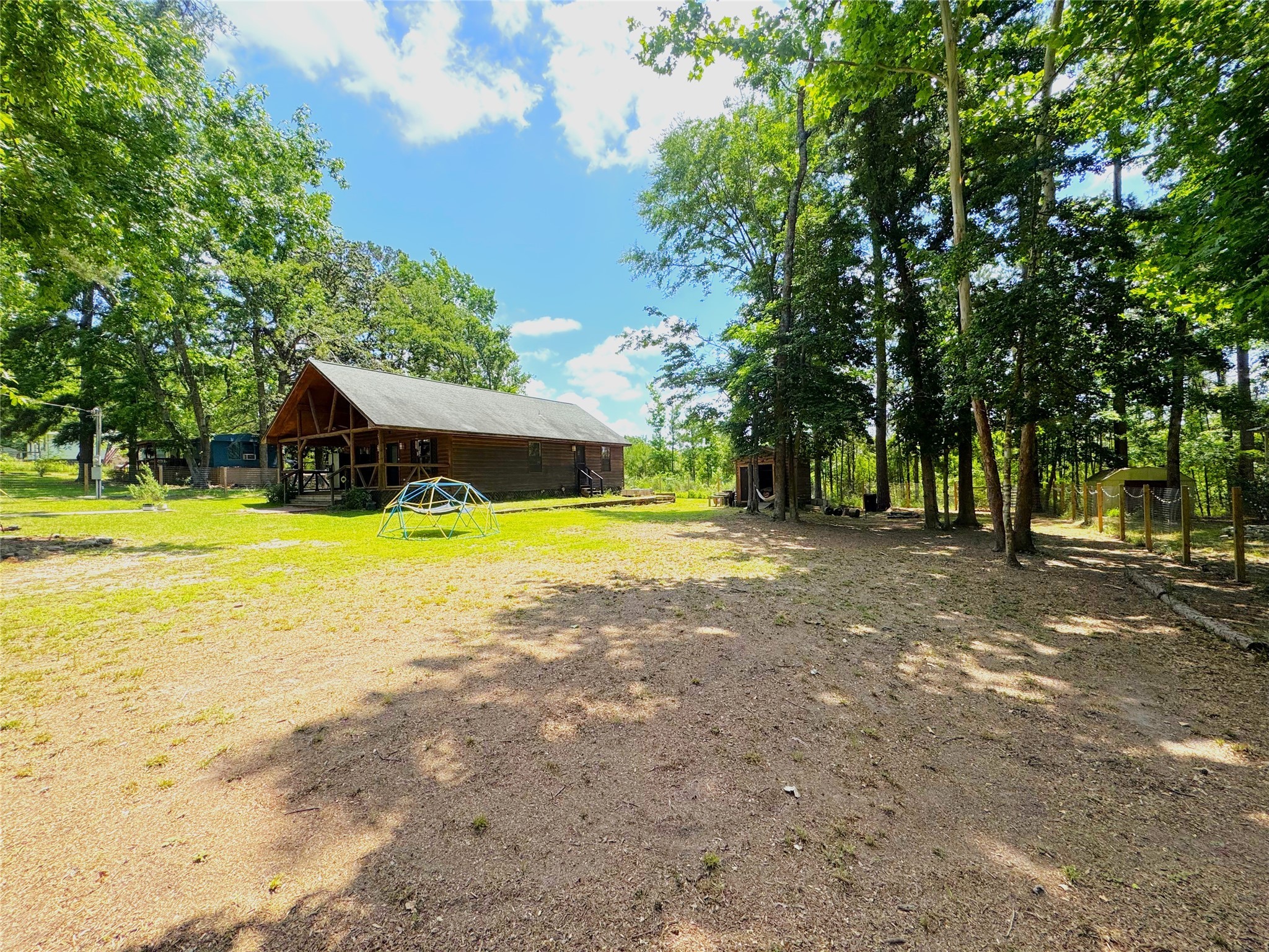 798 Port Boulevard Trinity, TX 75862 - Photo 24 of 31 a view of a house with swimming pool and next to a big yard