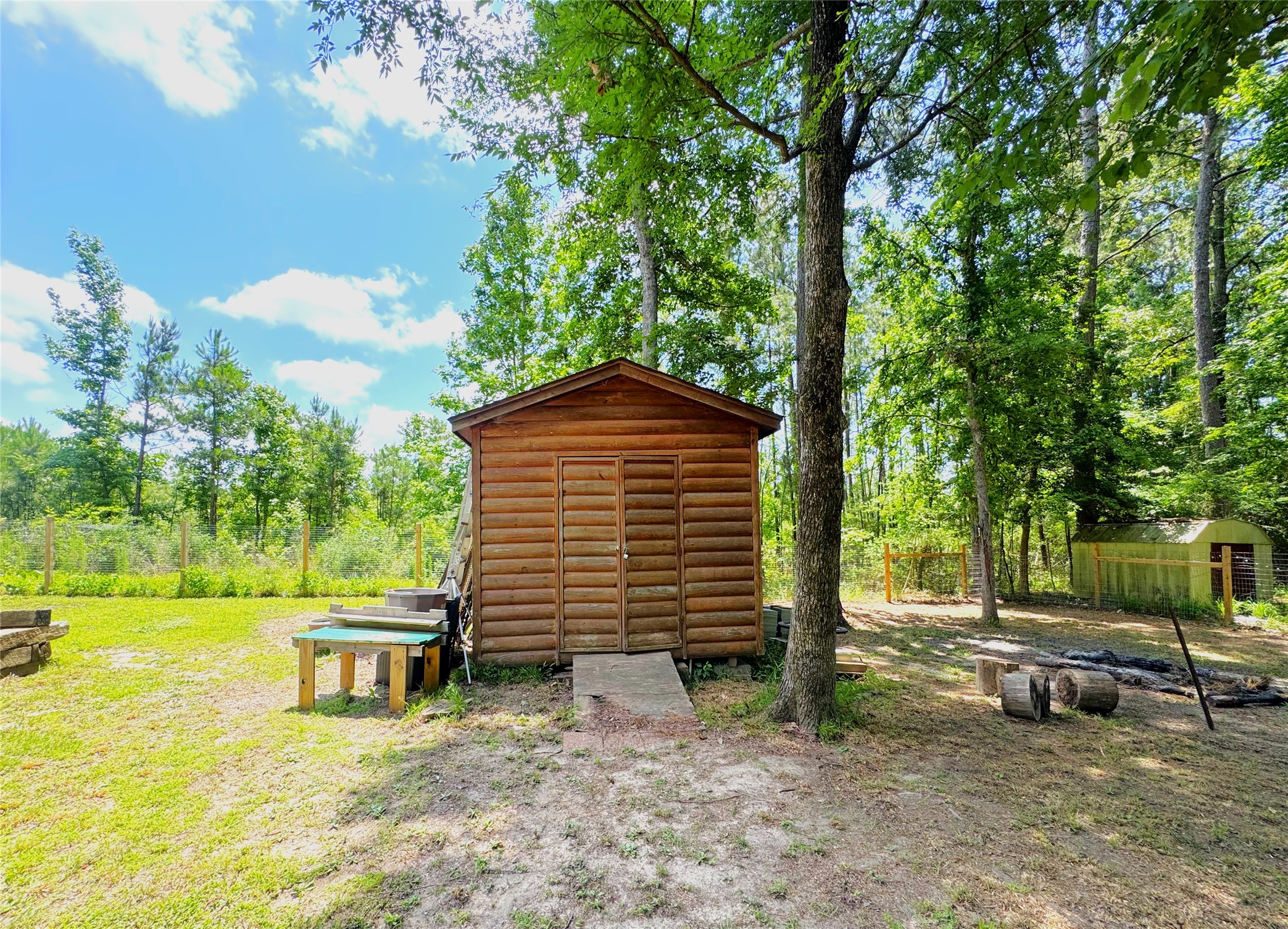 798 Port Boulevard Trinity, TX 75862 - Photo 25 of 31 a backyard of a house with table and chairs