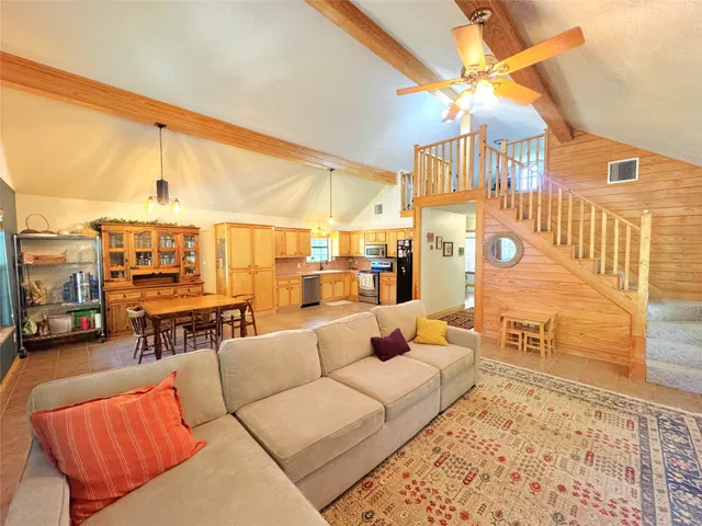 a balcony with furniture and a chandelier