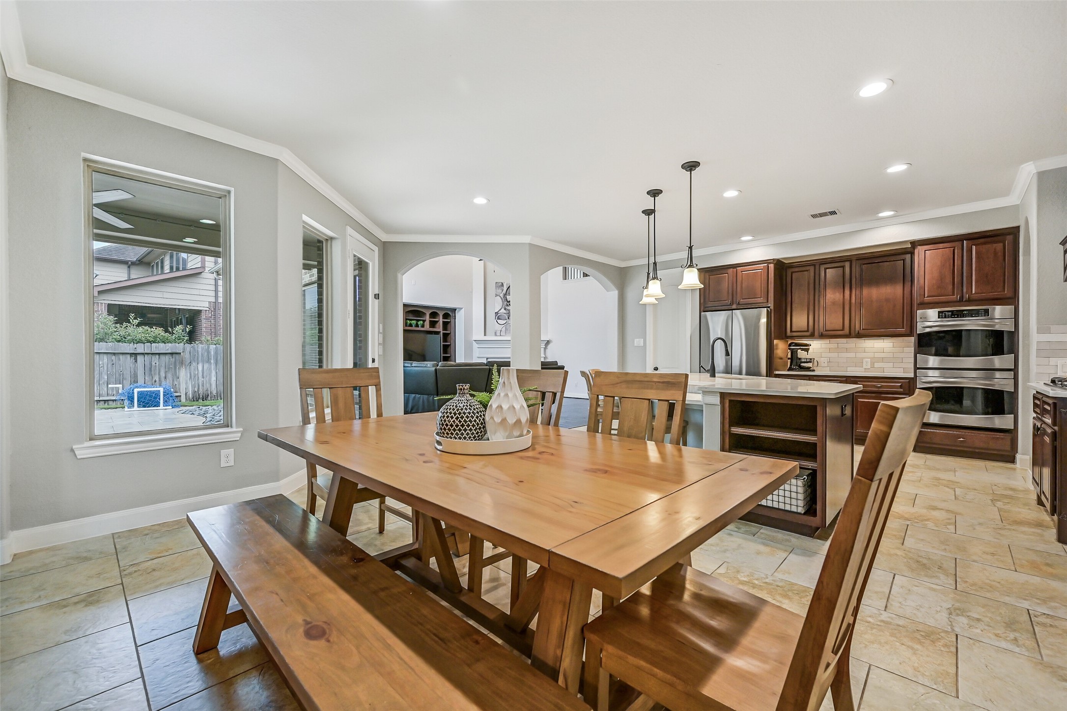 1008 Point Isabel Lane Friendswood, TX 77546 - Photo 19 of 50 A second view highlights the connection between the breakfast area and kitchen, creating an easy flow for daily meals and entertaining while maintaining a comfortable, open feel.