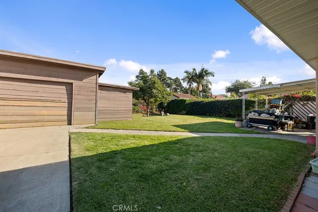 a view of swimming pool with outdoor seating and city view