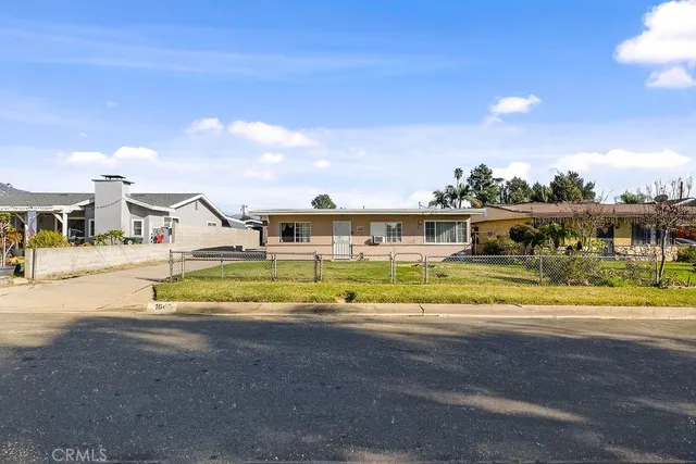 a view of a house with a backyard porch and sitting area