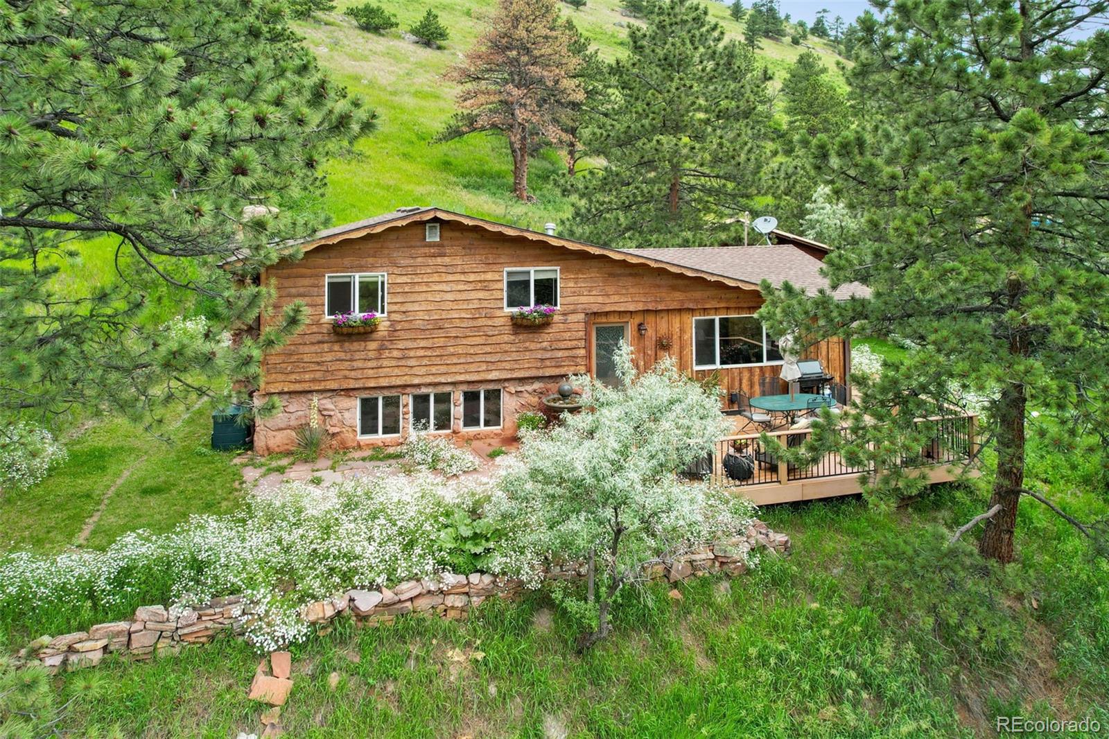 7193 Olde Stage Road Boulder, CO 80302 - Photo 4 of 40 a house with trees in the background