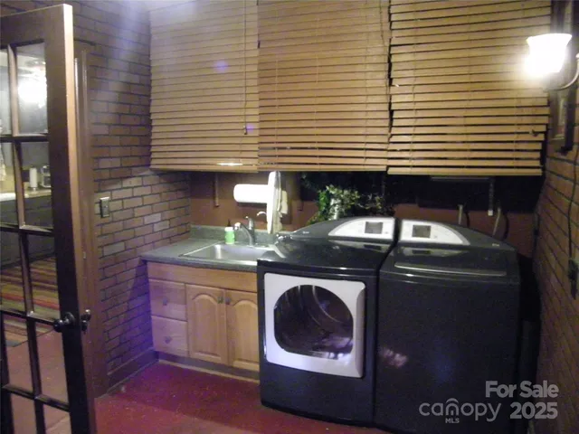 a close view of a sink a washer and dryer