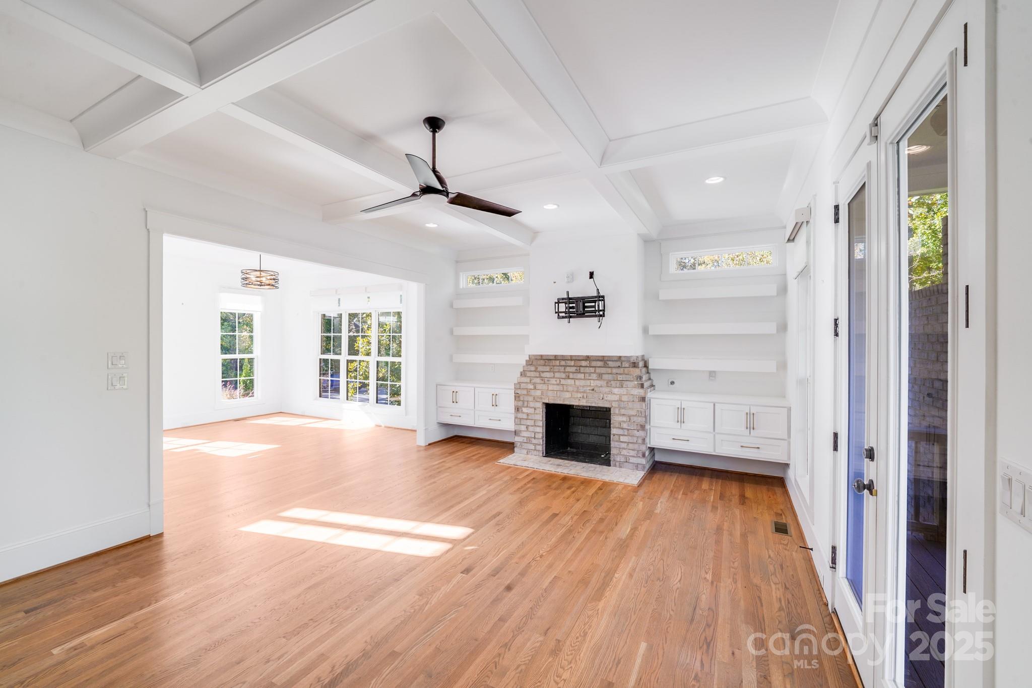 6541 Gardner Lane Charlotte, NC 28270 - Photo 12 of 47 a view of empty room with wooden floor and fireplace