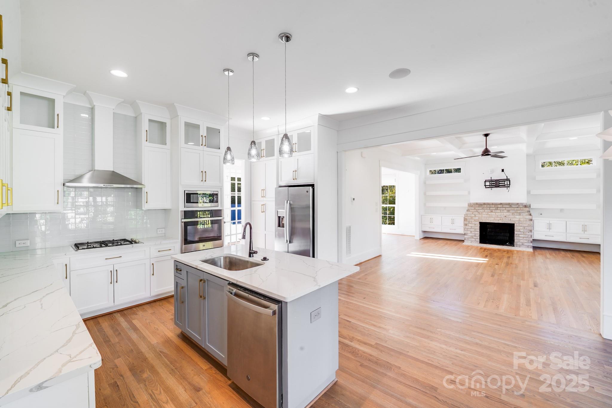 6541 Gardner Lane Charlotte, NC 28270 - Photo 16 of 47 a large kitchen with stainless steel appliances granite countertop a stove and a sink