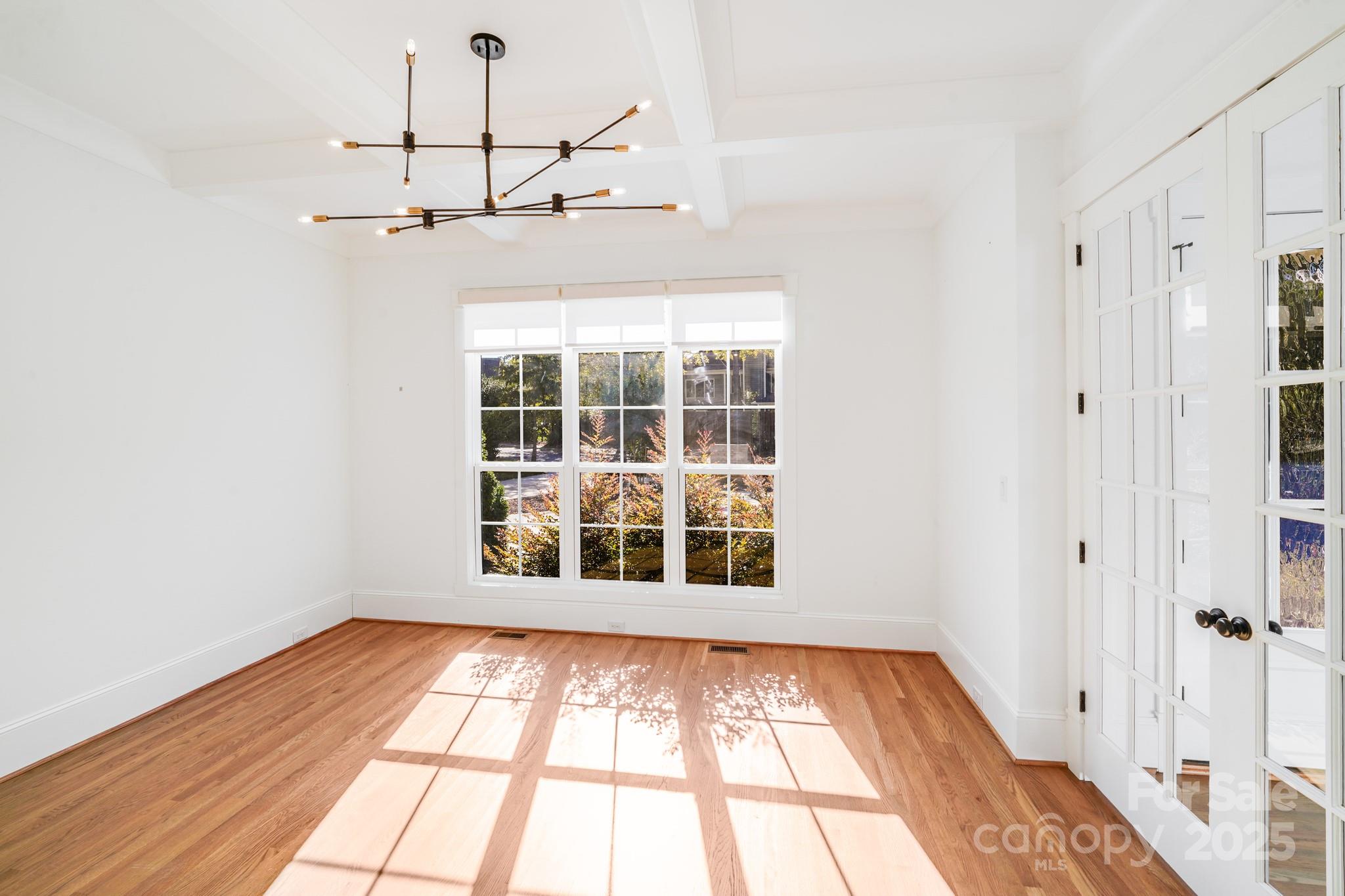 6541 Gardner Lane Charlotte, NC 28270 - Photo 23 of 47 a view of empty room with a window and wooden floor