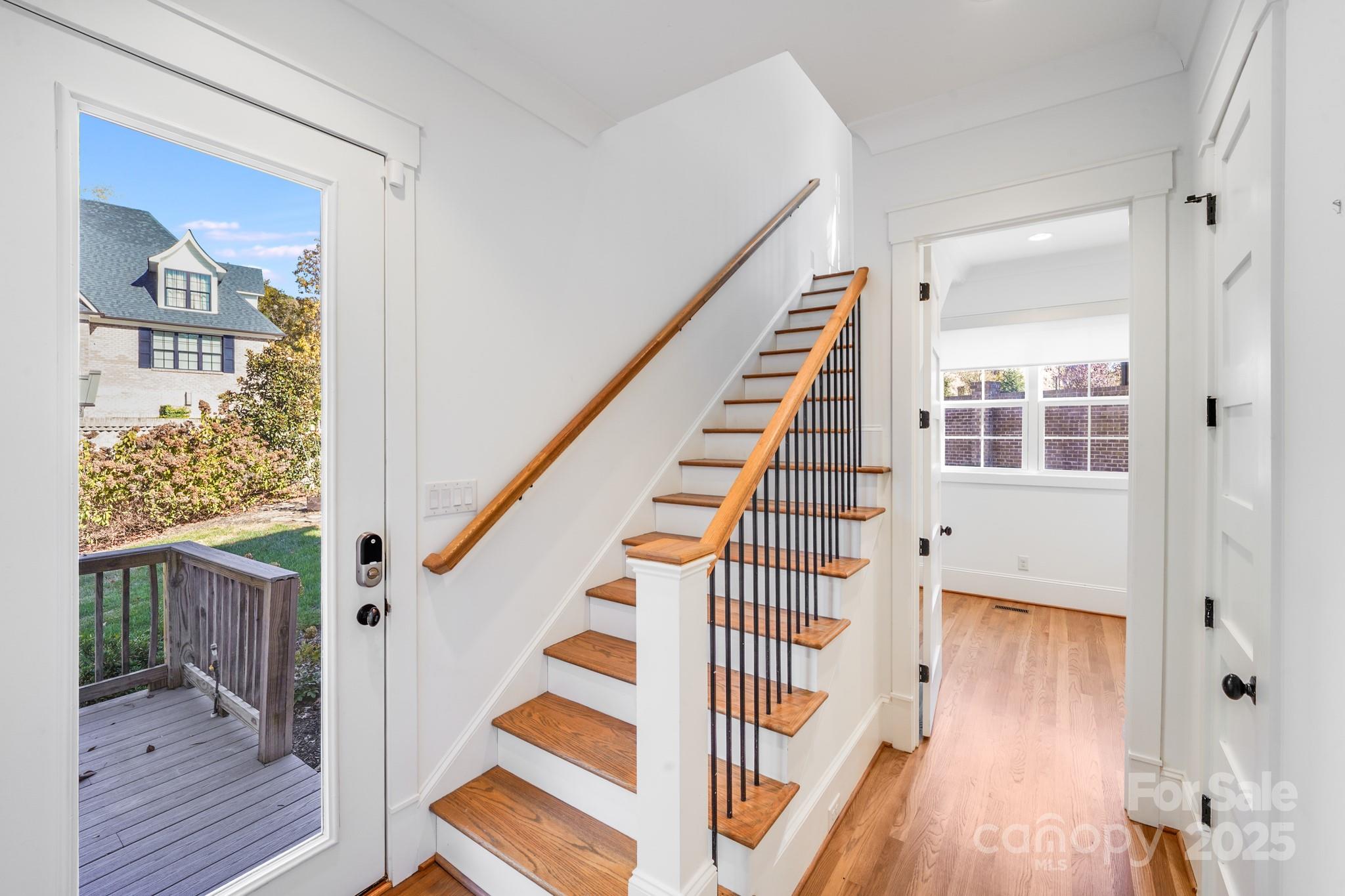 6541 Gardner Lane Charlotte, NC 28270 - Photo 25 of 47 a view of a hallway with wooden floor and entryway