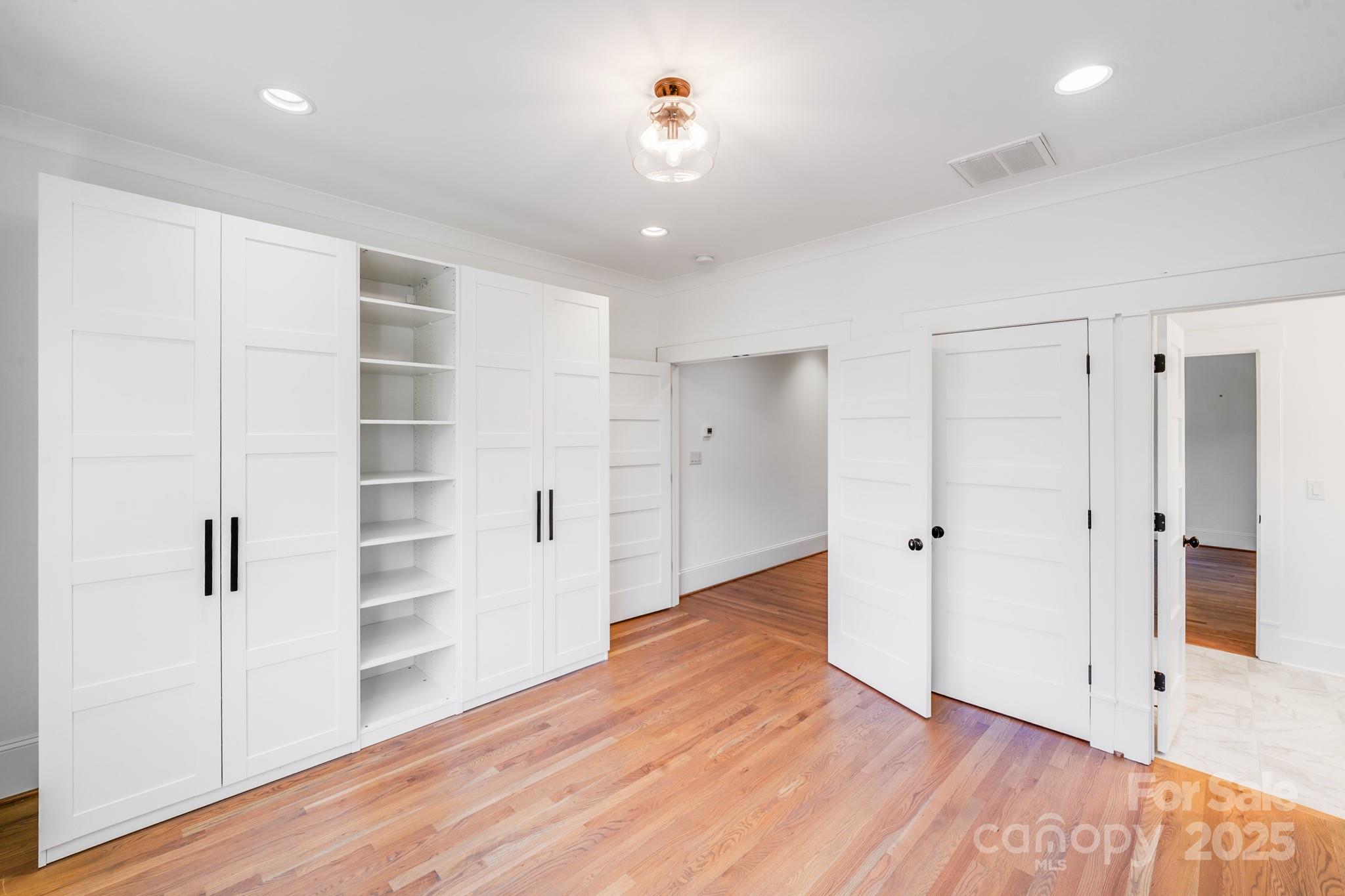 6541 Gardner Lane Charlotte, NC 28270 - Photo 27 of 47 wooden floor in an empty room with a window