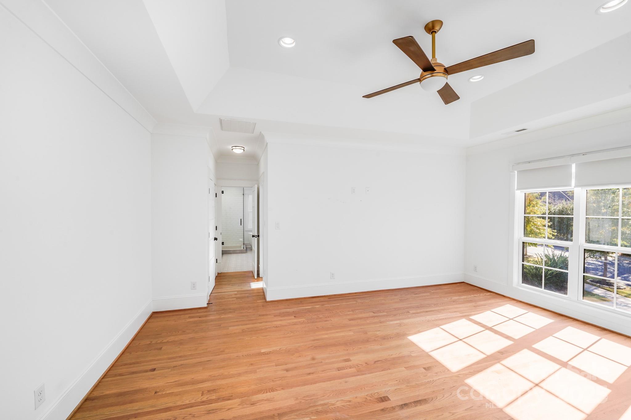 6541 Gardner Lane Charlotte, NC 28270 - Photo 31 of 47 a view of empty room with wooden floor and window
