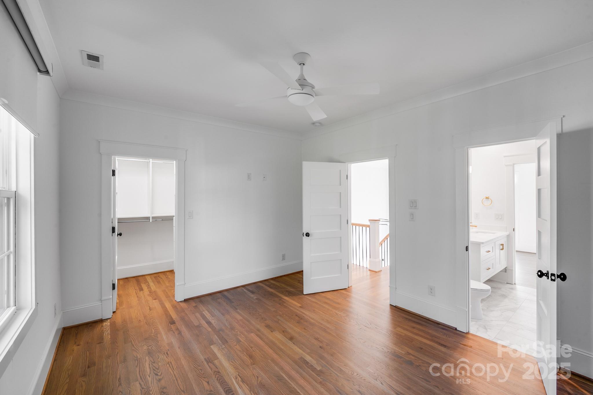 6541 Gardner Lane Charlotte, NC 28270 - Photo 35 of 47 an empty room with wooden floor and windows
