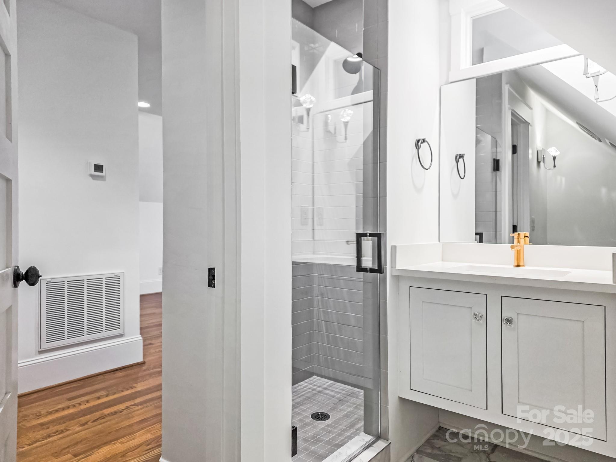 6541 Gardner Lane Charlotte, NC 28270 - Photo 39 of 47 a bathroom with a shower tub and mirror