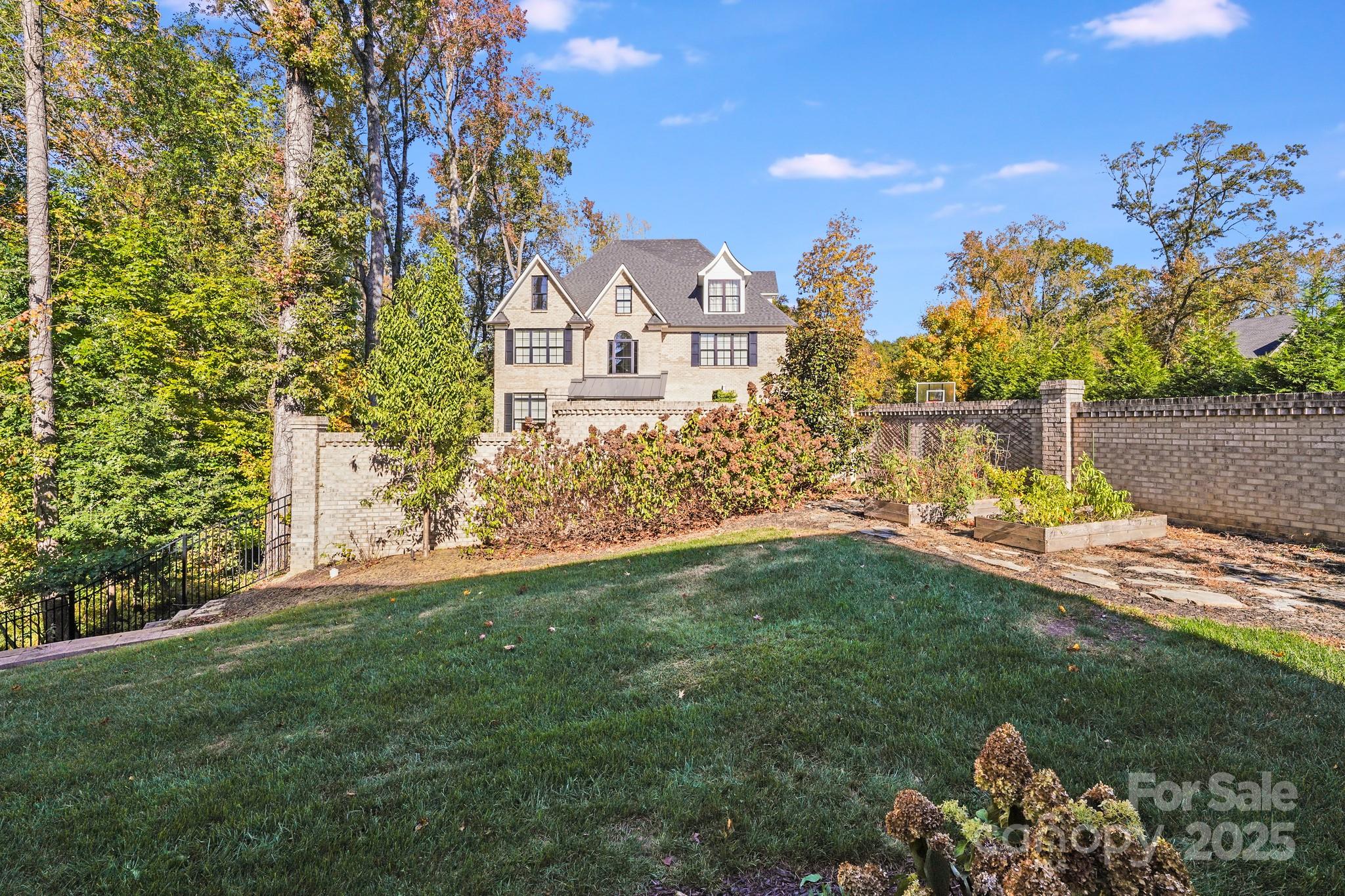 6541 Gardner Lane Charlotte, NC 28270 - Photo 42 of 47 a view of a house with a garden
