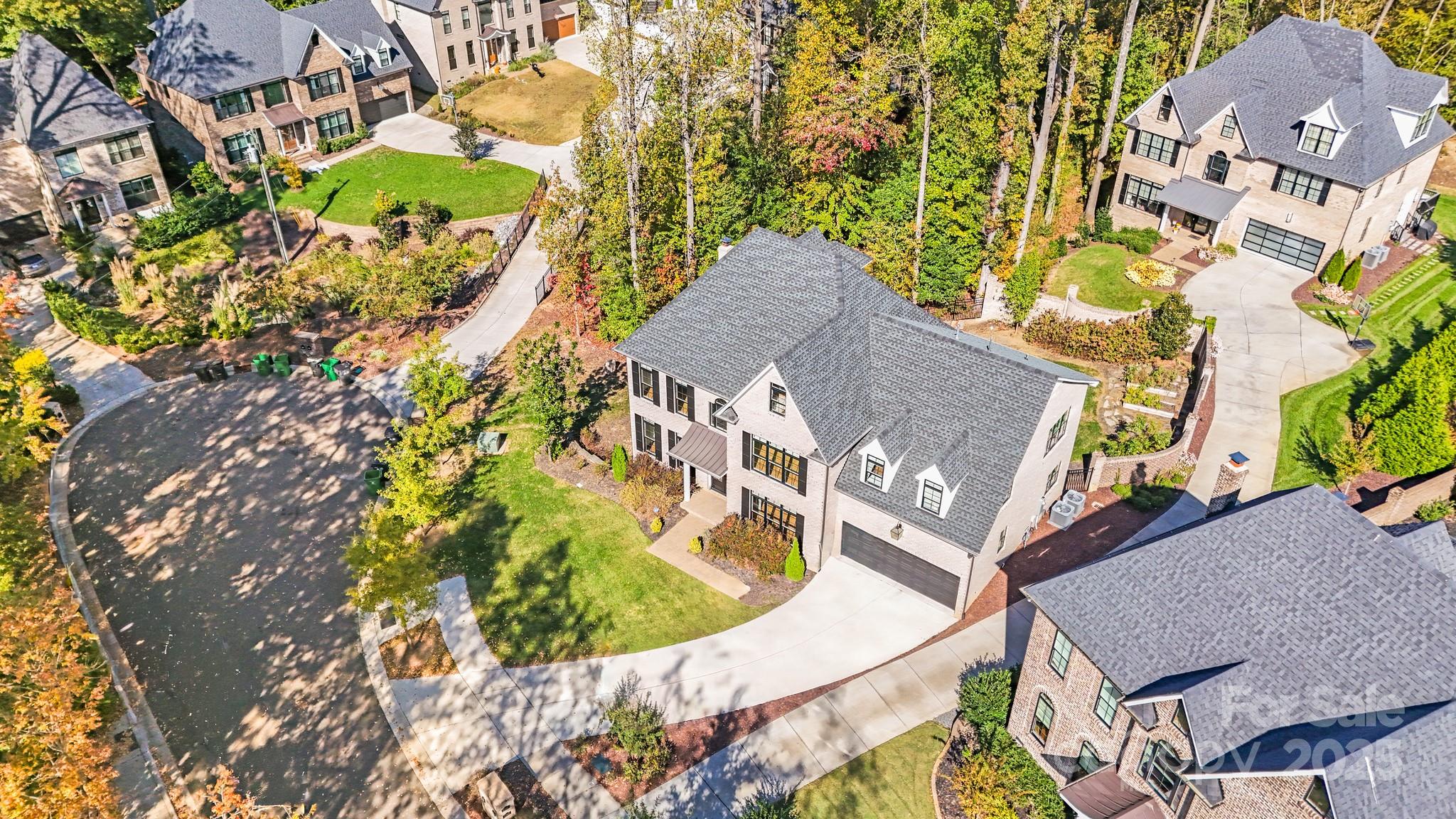 6541 Gardner Lane Charlotte, NC 28270 - Photo 46 of 47 an aerial view of a house with a yard and swimming pool