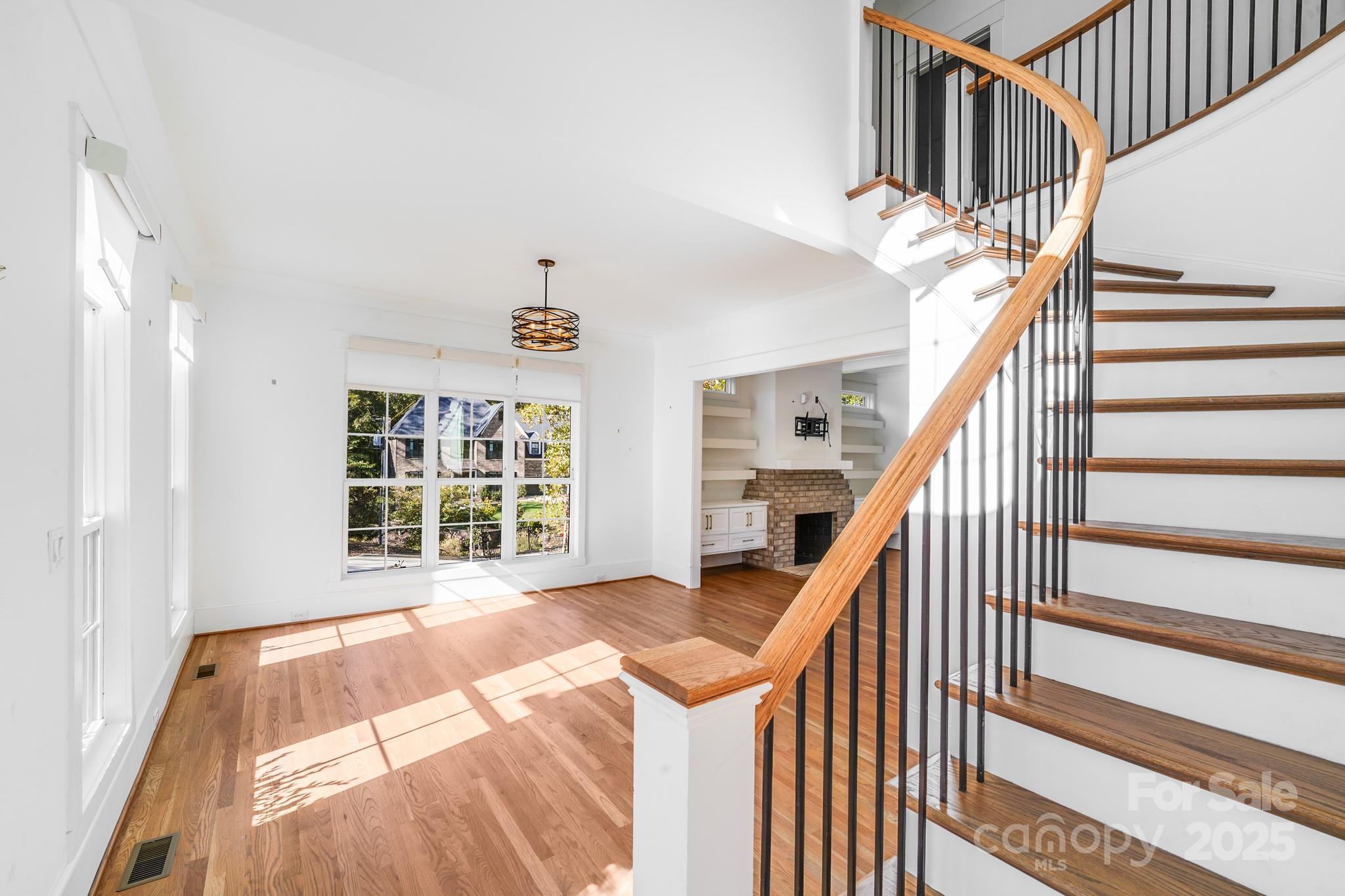 6541 Gardner Lane Charlotte, NC 28270 - Photo 6 of 47 a view of an entryway with wooden floor and stairs