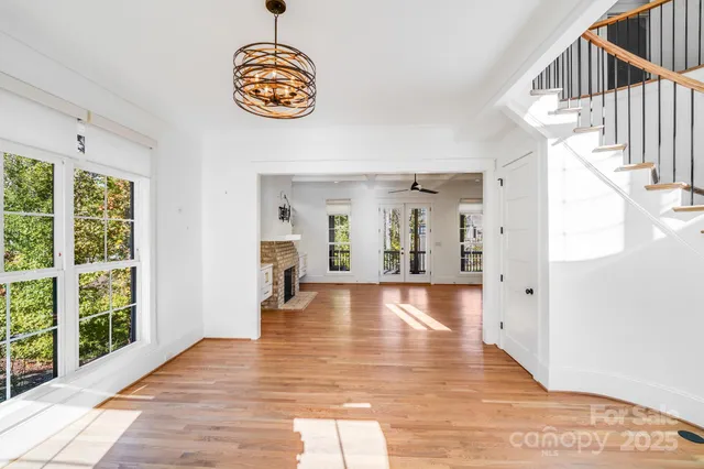 a view of an entryway with wooden floor