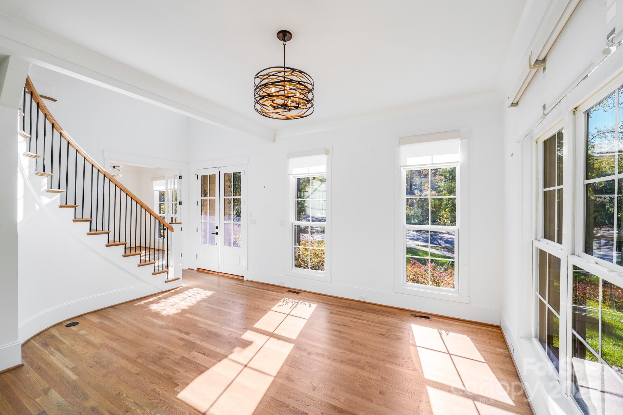 6541 Gardner Lane Charlotte, NC 28270 - Photo 10 of 47 a view of an empty room with stairs and a window