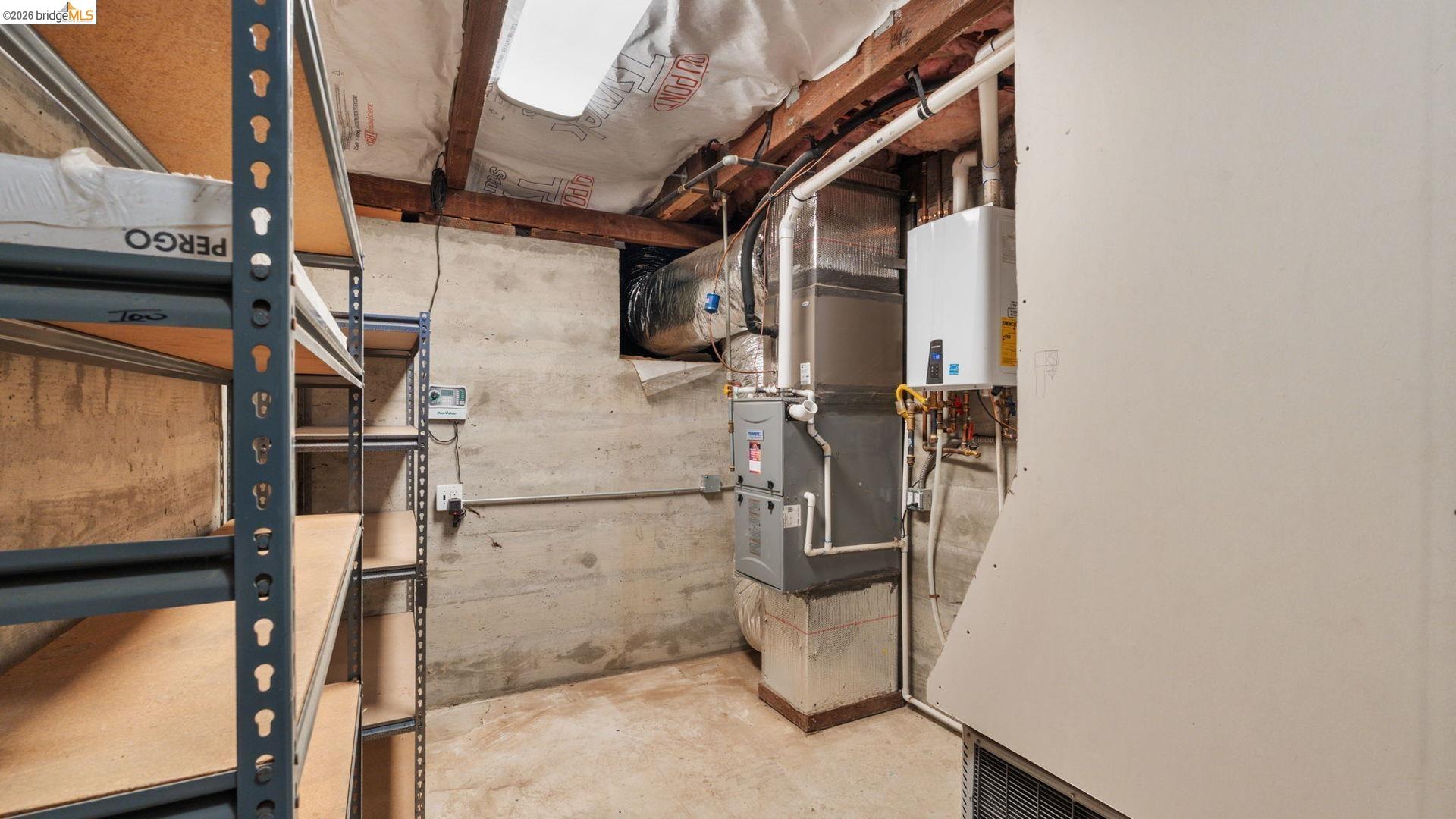 700 Brownstone Road Oakley, CA 94561 - Photo 28 of 58 Utility area featuring concrete walls, exposed ceiling joists, and a skylight