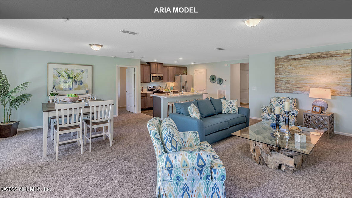 65458 River Glen Parkway Yulee, FL 32097 - Photo 12 of 47 a living room with furniture and a large window