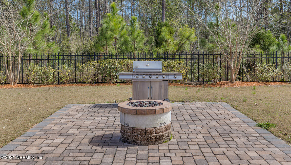 65458 River Glen Parkway Yulee, FL 32097 - Photo 31 of 47 a view of a couches and a table in the patio