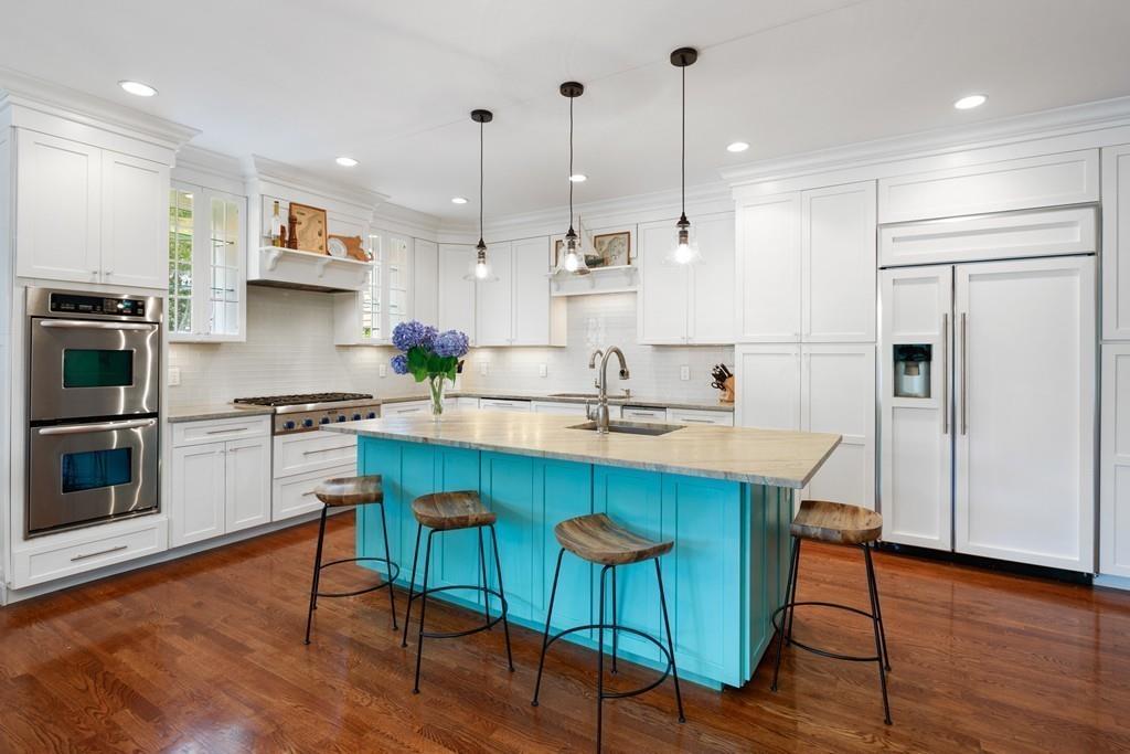 41 Kimball Beach Road Hingham, MA 02043 - Photo 12 of 42 a kitchen with stainless steel appliances granite countertop a sink a stove a refrigerator cabinets and wooden floor