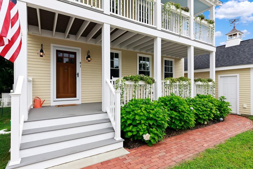 41 Kimball Beach Road Hingham, MA 02043 - Photo 2 of 42 a front view of a house with plants