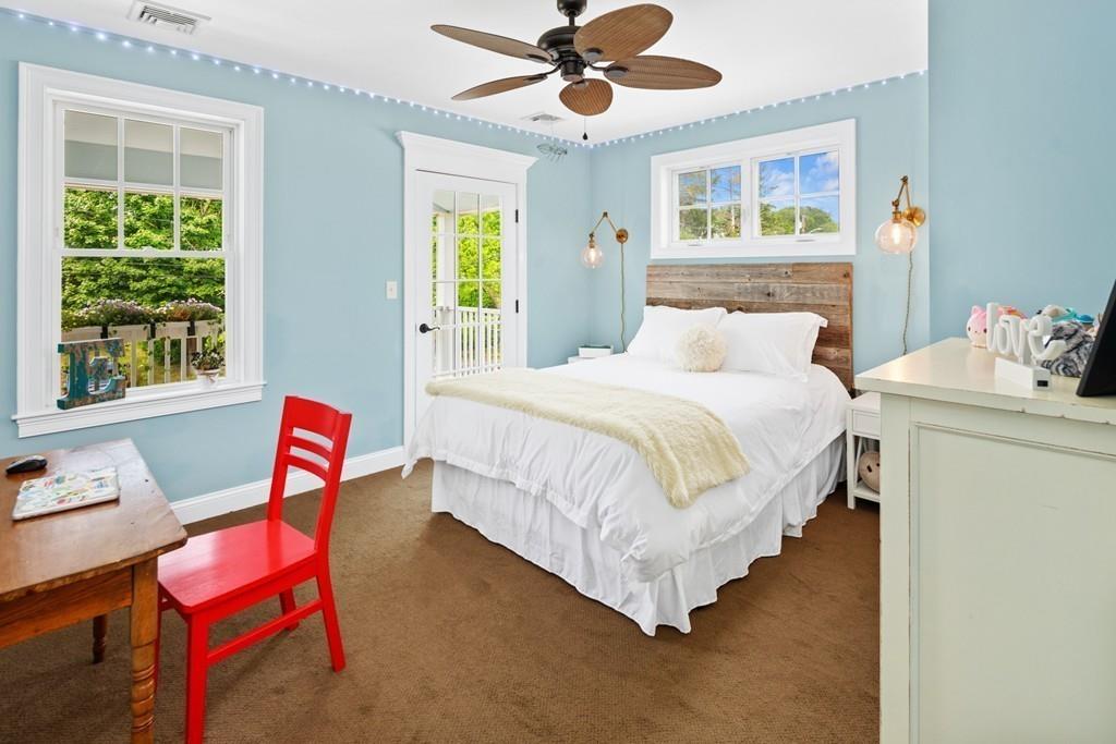 41 Kimball Beach Road Hingham, MA 02043 - Photo 23 of 42 a bedroom with a bed and a chair