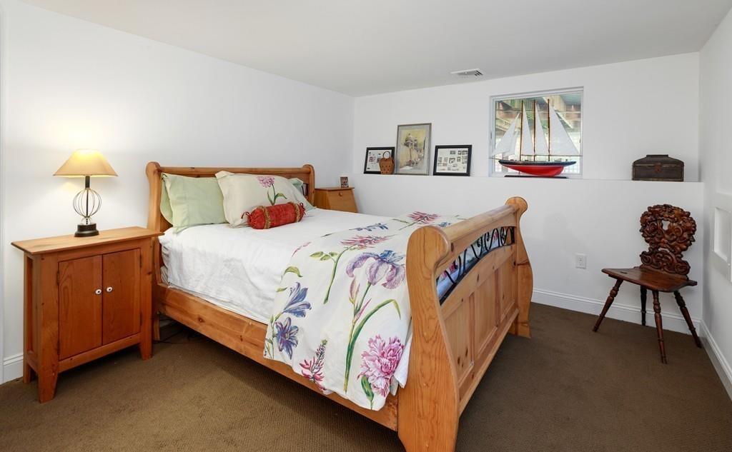 41 Kimball Beach Road Hingham, MA 02043 - Photo 32 of 42 a bedroom with a bed and dresser