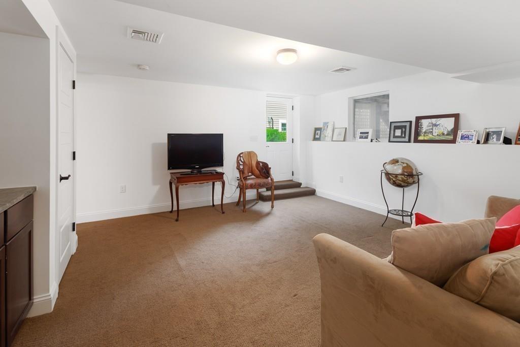 41 Kimball Beach Road Hingham, MA 02043 - Photo 34 of 42 a living room with furniture and a flat screen tv