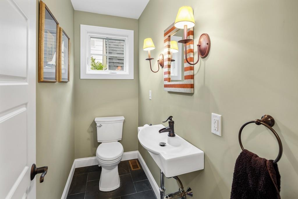 41 Kimball Beach Road Hingham, MA 02043 - Photo 8 of 42 a bathroom with a toilet sink and mirror