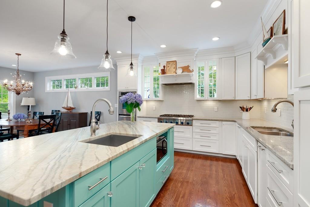 41 Kimball Beach Road Hingham, MA 02043 - Photo 10 of 42 a kitchen with stainless steel appliances granite countertop a sink stove and cabinets