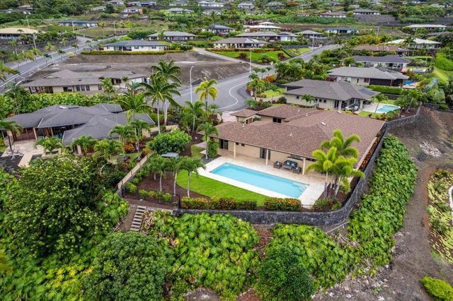an aerial view of a house with a garden