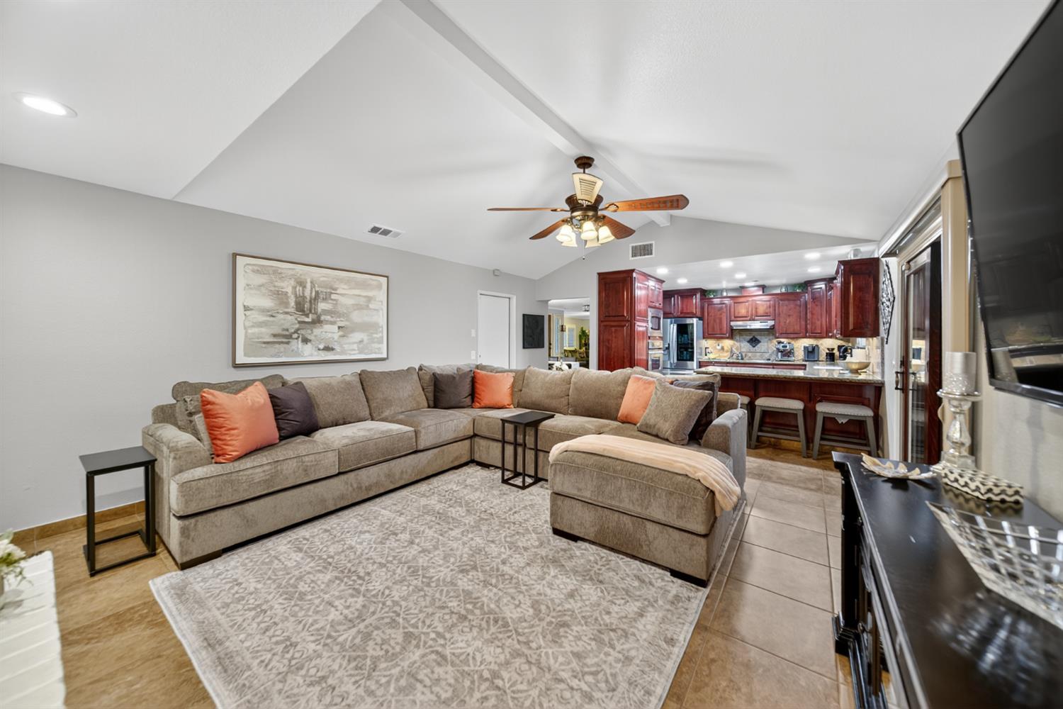 101 Mainberry Drive Madera, CA 93637 - Photo 13 of 40 a living room with furniture kitchen view and a flat screen tv