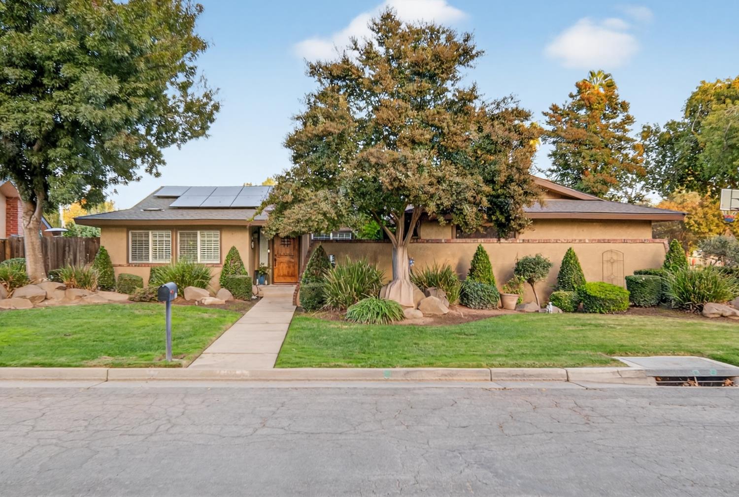 101 Mainberry Drive Madera, CA 93637 - Photo 2 of 40 a view of a house with a garden
