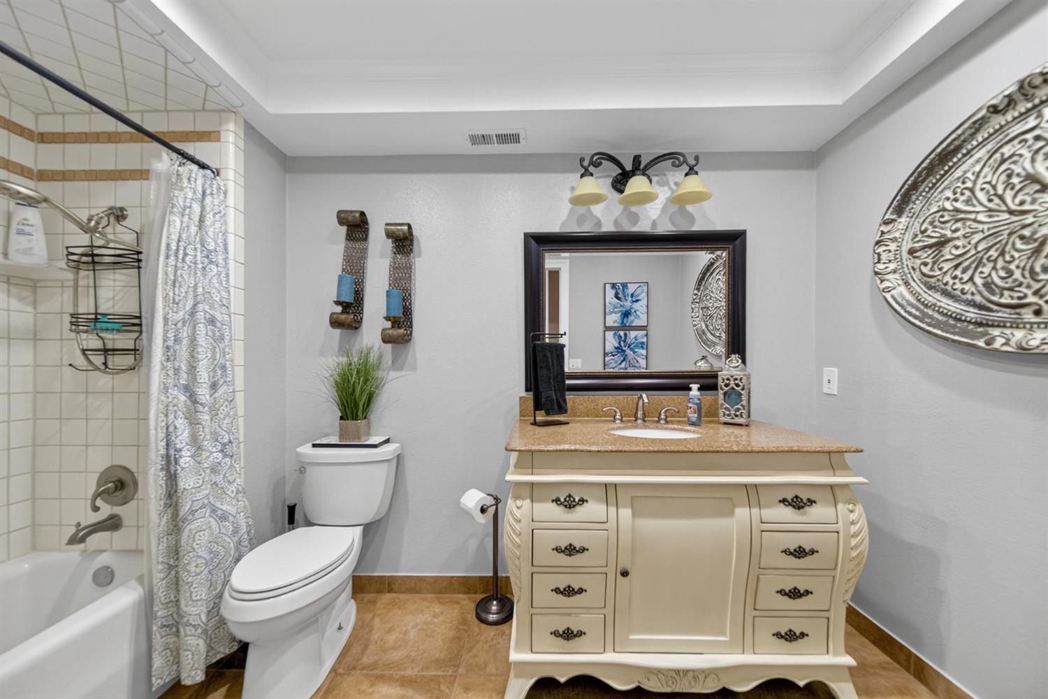101 Mainberry Drive Madera, CA 93637 - Photo 22 of 40 a bathroom with a sink toilet and shower