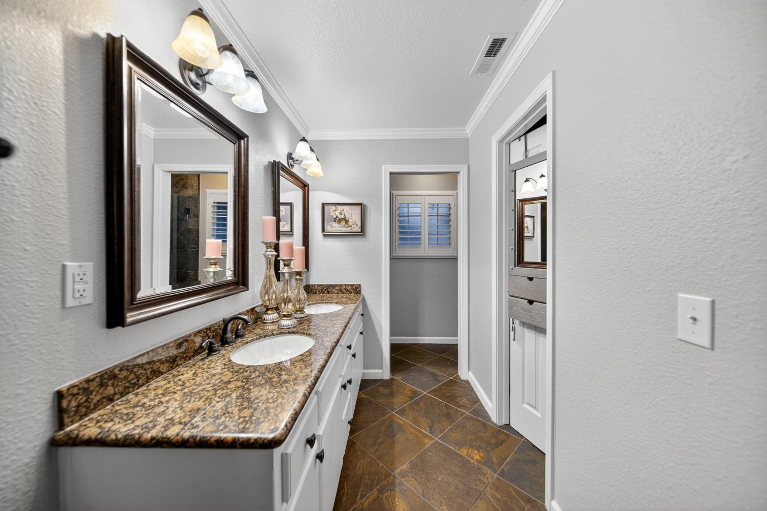 101 Mainberry Drive Madera, CA 93637 - Photo 30 of 40 a bathroom with a granite countertop sink and a mirror