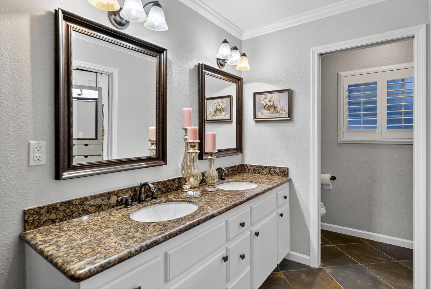 101 Mainberry Drive Madera, CA 93637 - Photo 31 of 40 a bathroom with a granite countertop sink and a mirror