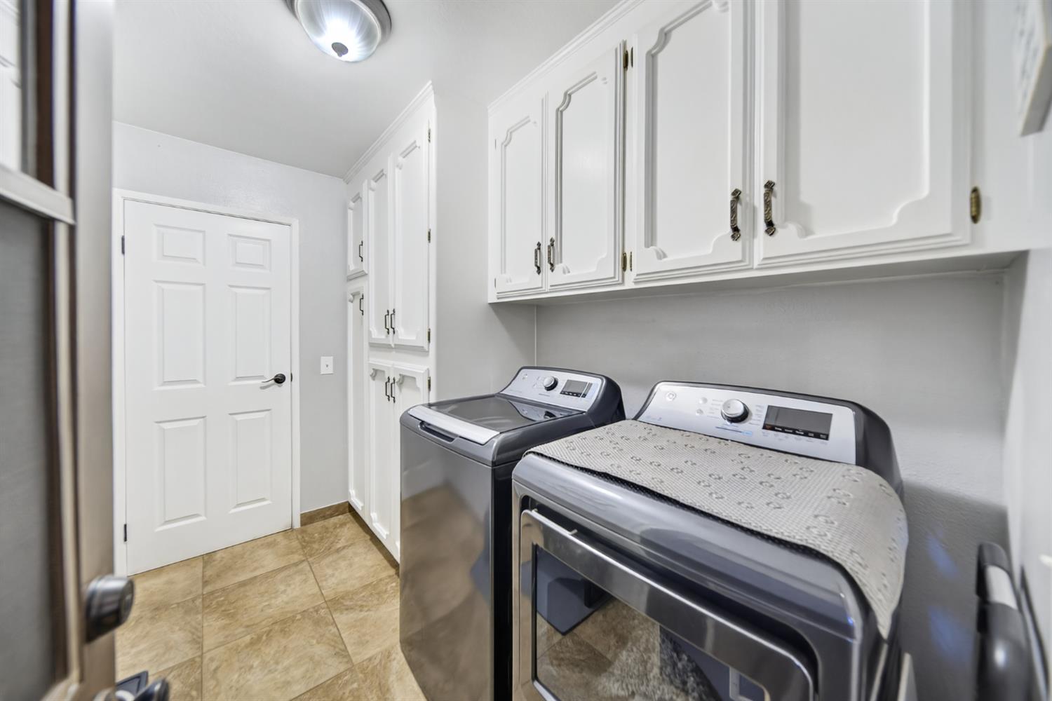 101 Mainberry Drive Madera, CA 93637 - Photo 34 of 40 a utility room with dryer and washer