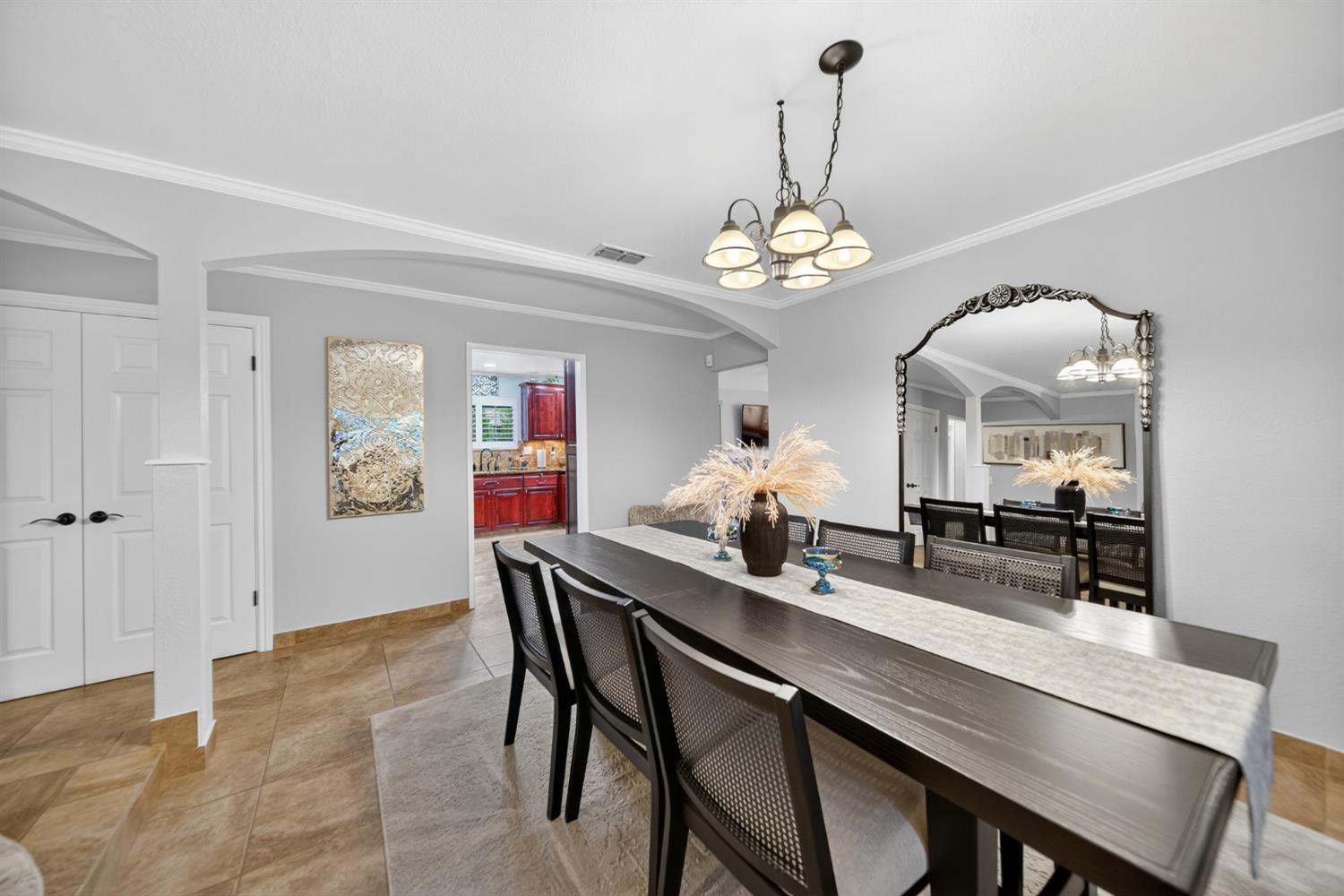 101 Mainberry Drive Madera, CA 93637 - Photo 10 of 40 a view of a dining room with furniture wooden floor and chandelier
