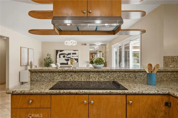 a view of a counter top a sink and cabinets
