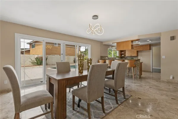 a view of a dining room with furniture window and outside view