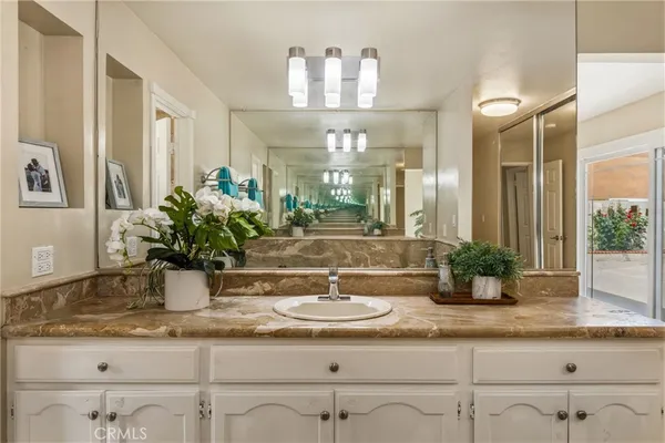 a bathroom with sink and mirror
