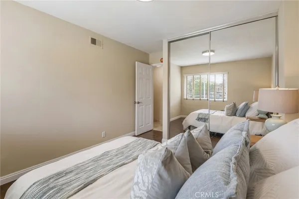a bed room with a bed and a window