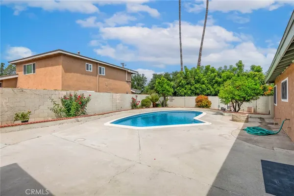 a view of a swimming pool with a patio