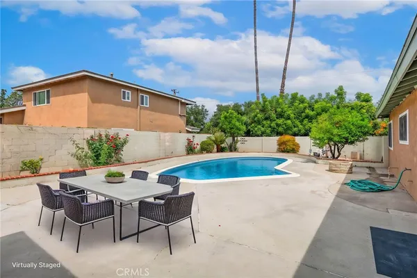 a view of a swimming pool with a patio