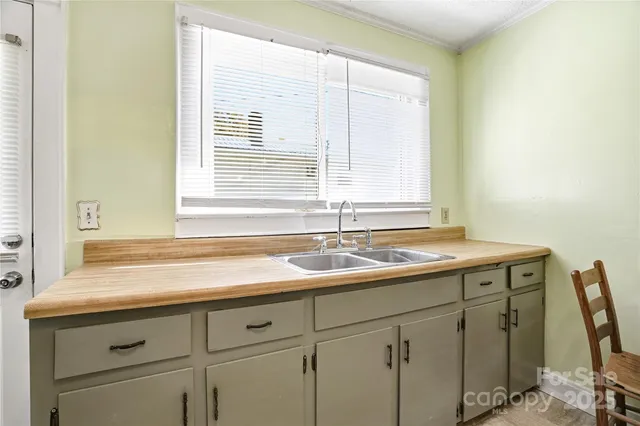 a bathroom with a sink a toilet and shower curtain