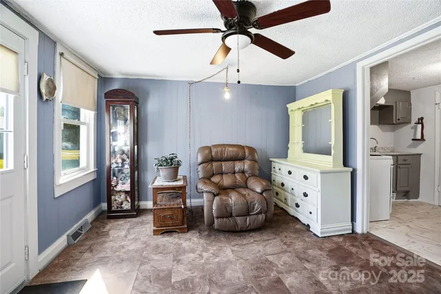 a kitchen with granite countertop a sink stainless steel appliances and cabinets